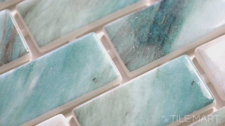 Video featuring Onix Glass Zaira Brick Glossy Mosaic. A polished glass brick mosaic that offers a sleek and reflective surface, enhancing kitchen and bathroom walls.