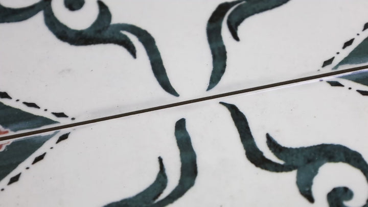 Video featuring Andratx Dragonera Green 6x6 Glossy Porcelain. A rich green glossy porcelain tile with a sleek finish, creating a fresh and elegant look with a smooth, reflective surface.