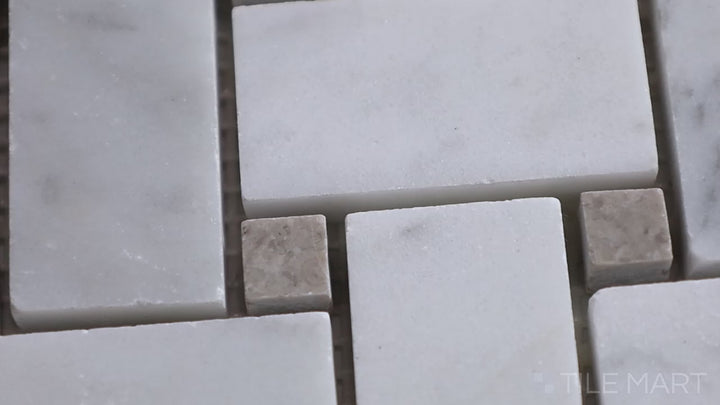 Video featuring Sto-Re Carrara W/ Grey Dot Basketweave Polished Marble Mosaic. A luxurious Carrara marble mosaic in a basketweave design with grey dot details.