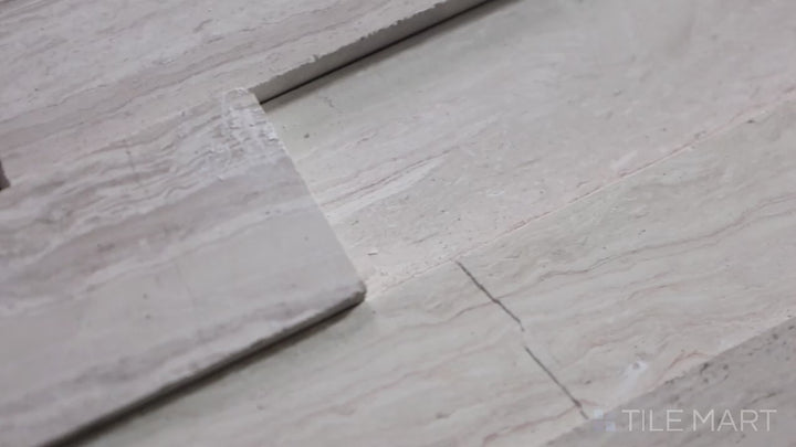 Video showcasing Rockmount White Oak 6X24 3D Stacked Stone Panel Honed Marble. A sophisticated white marble stacked stone panel with a three-dimensional effect.