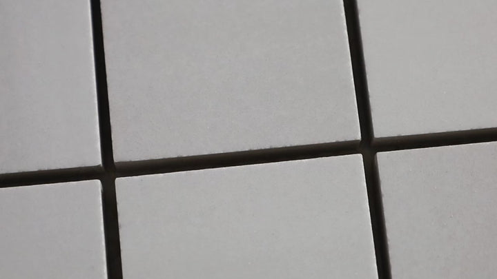 Video showcasing Luxury Deodat White 2-inch Square Polished Porcelain Mosaic. A white polished porcelain mosaic with subtle veining, adding a touch of sophistication.