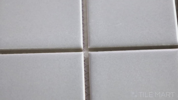 Video highlighting Porcelain Glazed Mosaics Gray 2-inch Square Matte. A neutral gray matte porcelain square mosaic, offering a sleek and modern aesthetic.